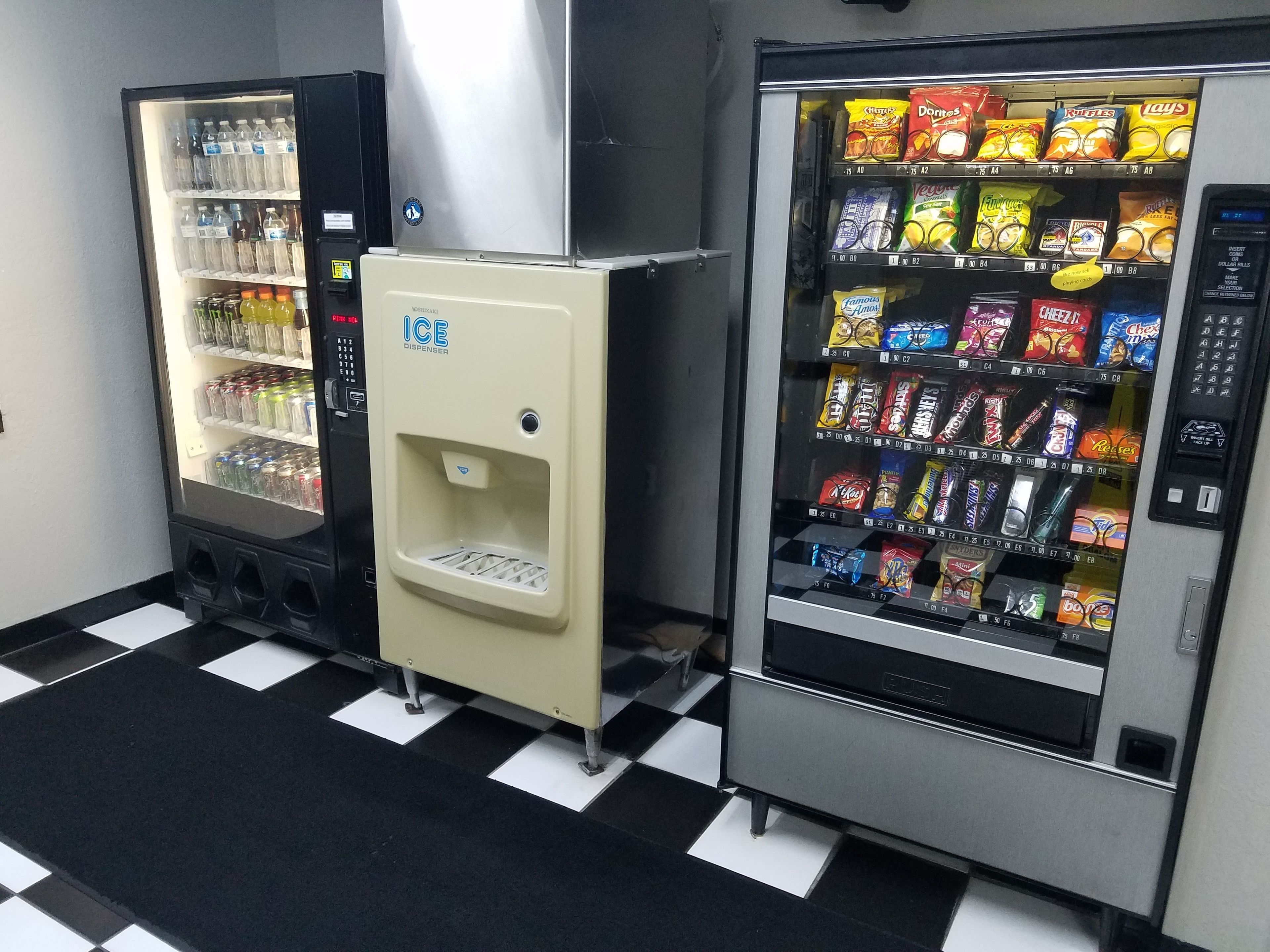 Two vending machines with a variety of snacks and drinks.