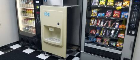 Two vending machines with a variety of snacks and drinks.