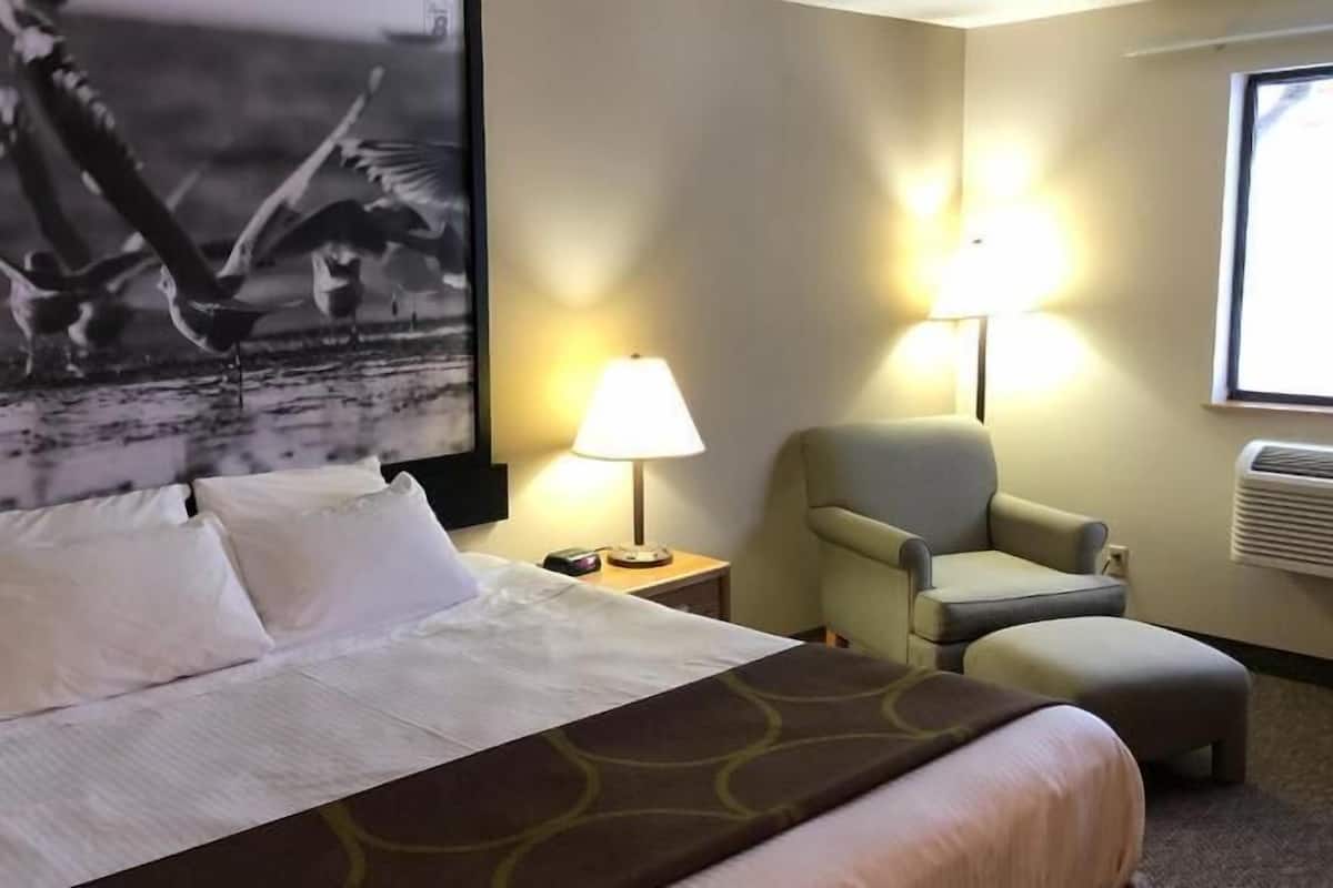 Desk, laptop workspace, blackout drapes, iron/ironing board