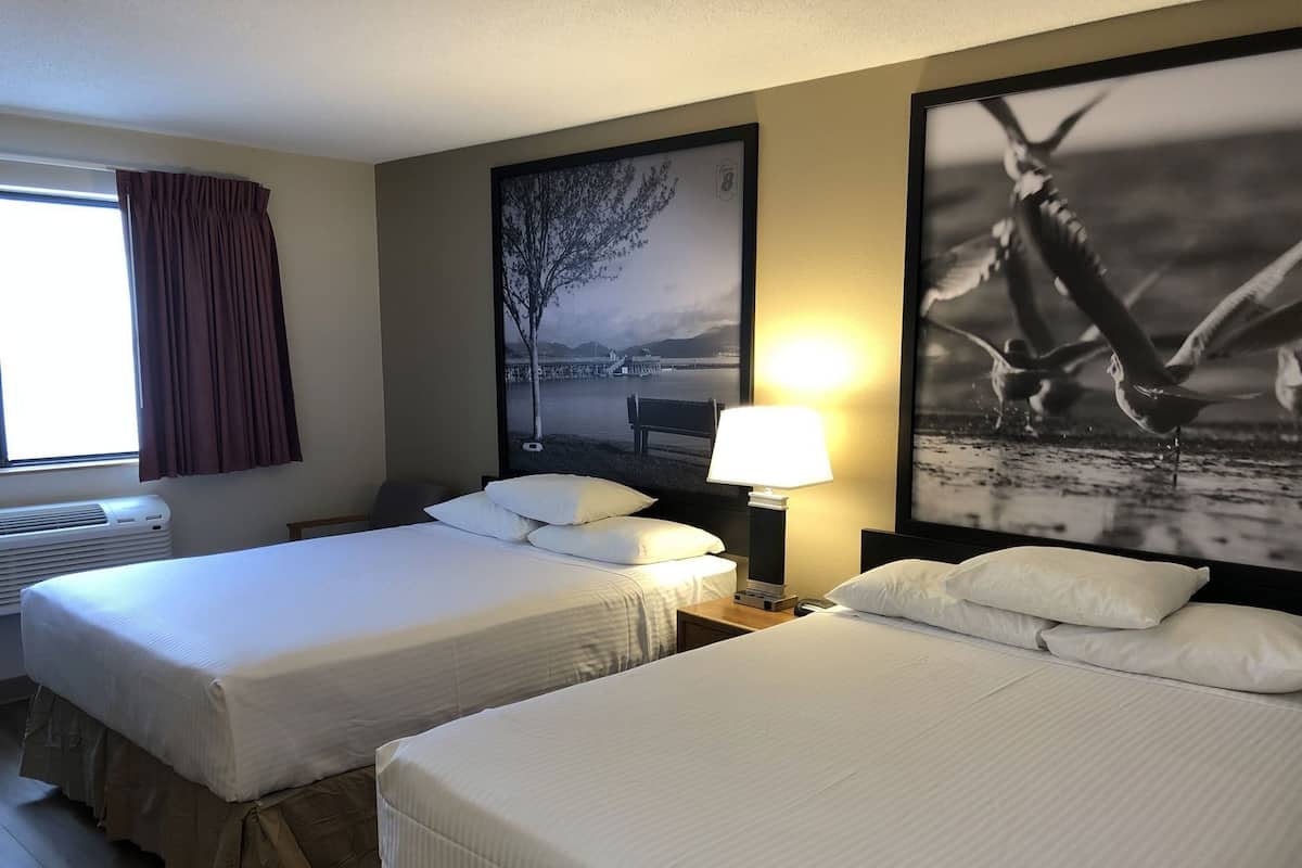 Desk, laptop workspace, blackout drapes, iron/ironing board