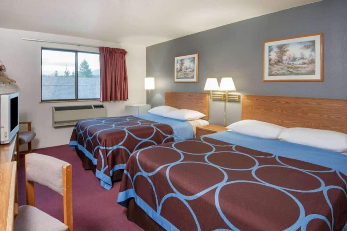 Desk, laptop workspace, blackout drapes, iron/ironing board