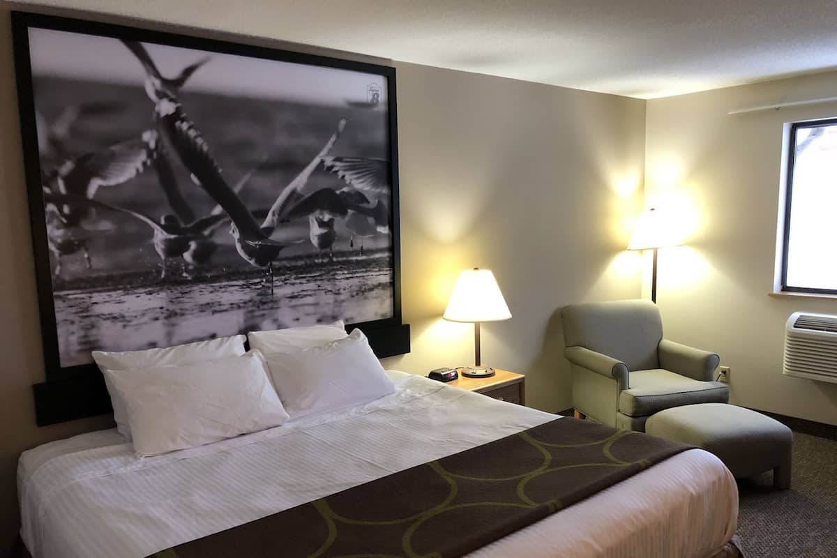 Desk, laptop workspace, blackout drapes, iron/ironing board