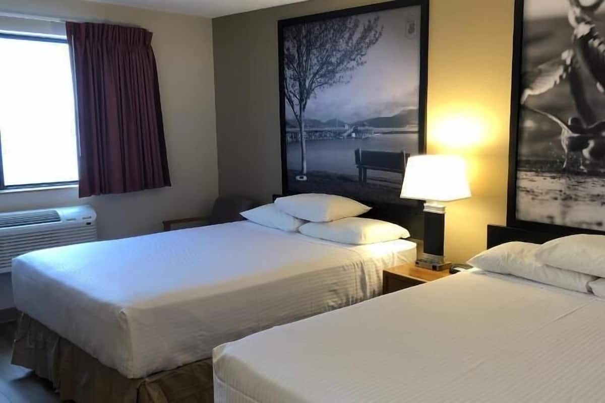 Desk, laptop workspace, blackout drapes, iron/ironing board