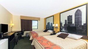 A hotel room with two beds, a desk, a television, and a large cityscape view. - Super 8 by Wyndham Perry IA (Perry)