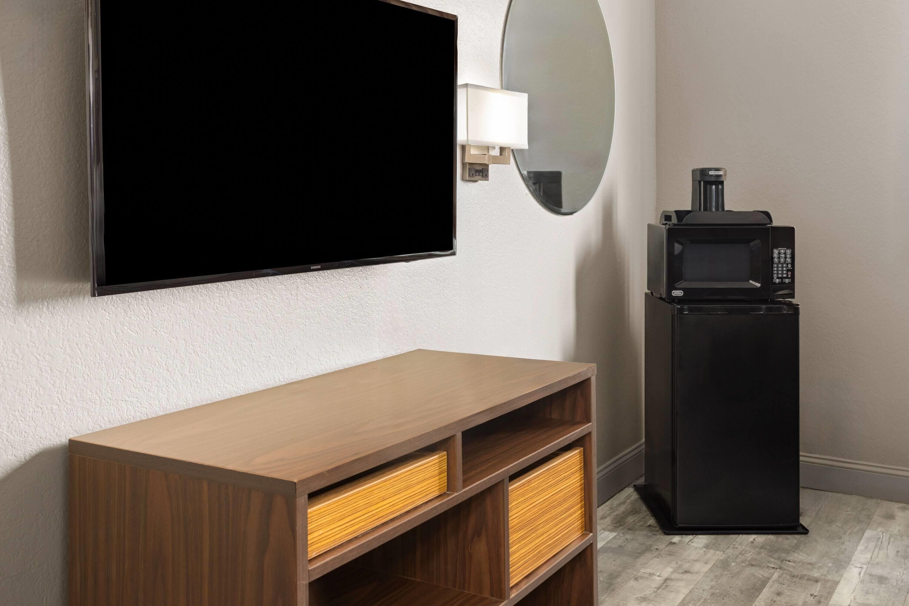 Desk, blackout drapes, iron/ironing board, free cribs/infant beds