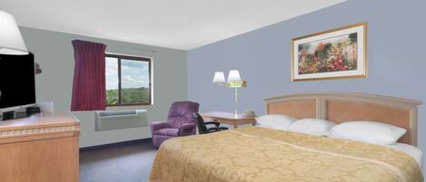 A hotel room with a large bed, a desk with a television, a chair, a window with curtains, a lamp, and a framed picture on the wall.