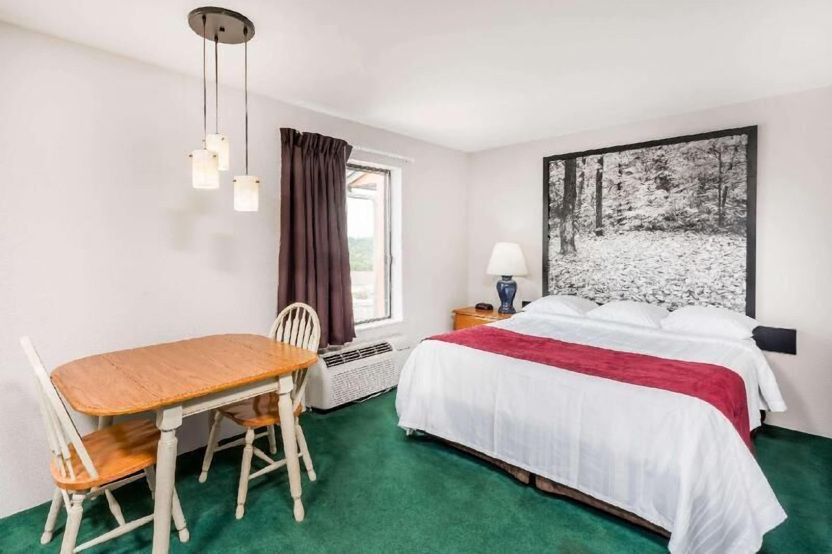 Desk, blackout curtains, free cots/infant beds, free WiFi