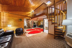 Suite, 1 King Bed, Hot Tub | Living area | 32-inch TV with cable channels