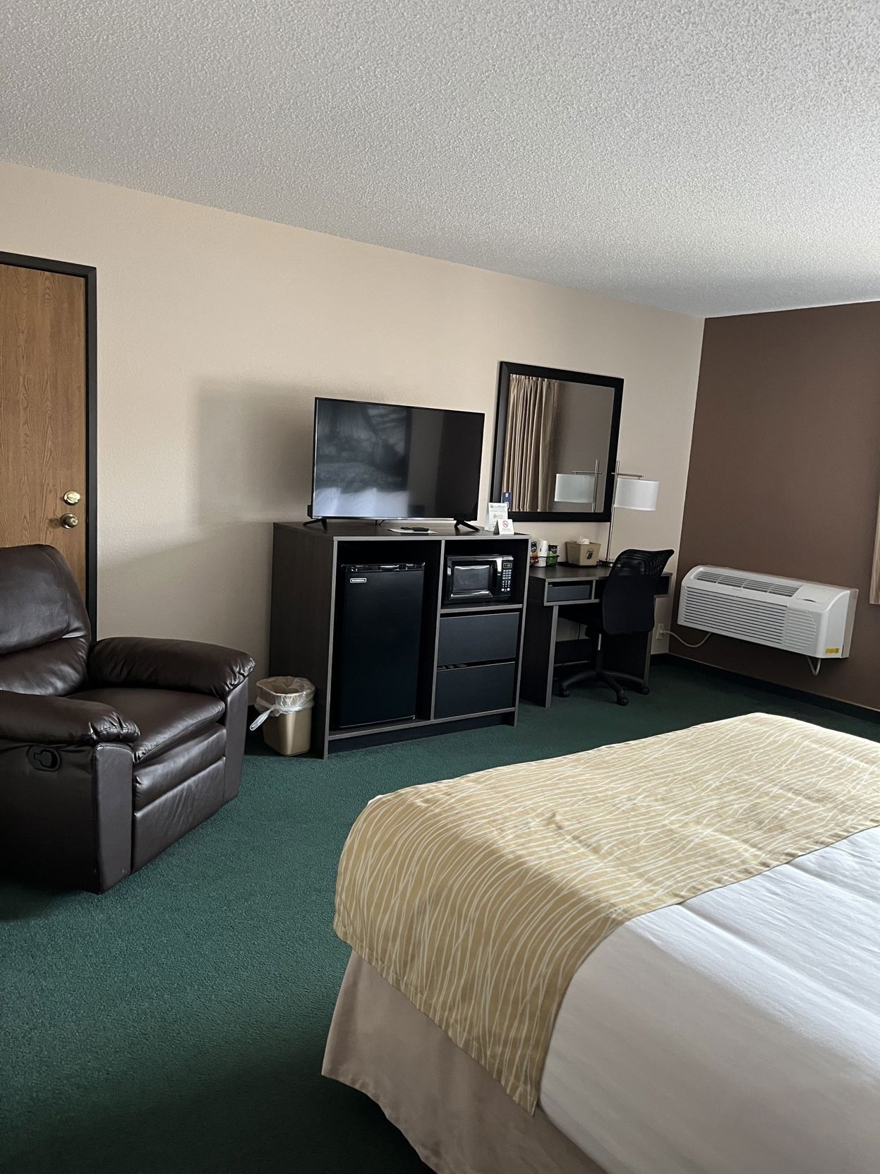 Premium bedding, desk, laptop workspace, blackout drapes