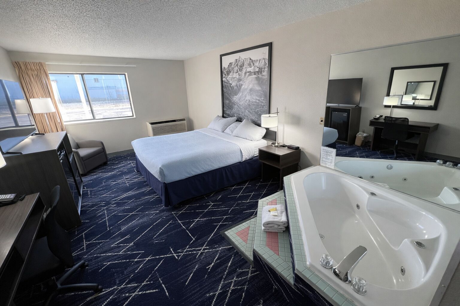 Suite, 1 Queen Bed, Jetted Tub | Premium bedding, desk, laptop workspace, blackout curtains