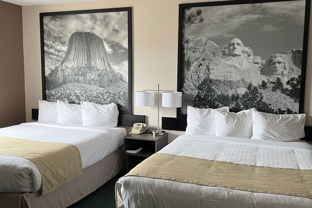 Premium bedding, desk, laptop workspace, blackout drapes