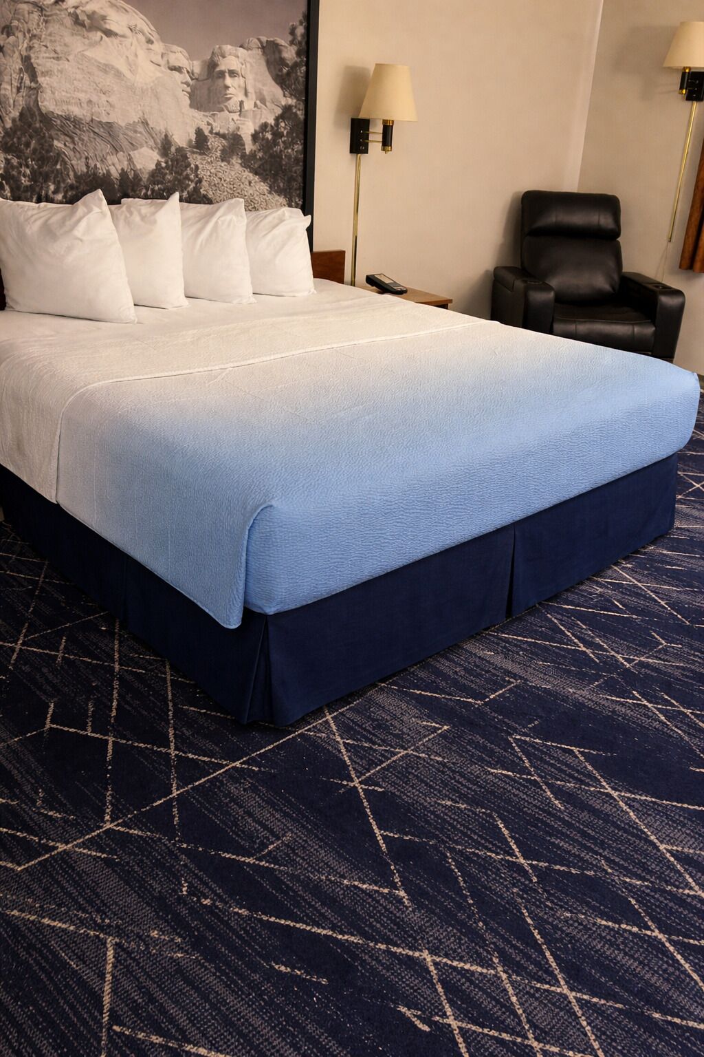 Premium bedding, desk, laptop workspace, blackout drapes