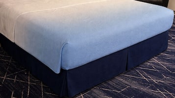 Premium bedding, desk, laptop workspace, blackout drapes