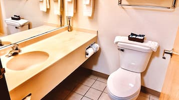 Combined shower/tub, designer toiletries, hair dryer, towels