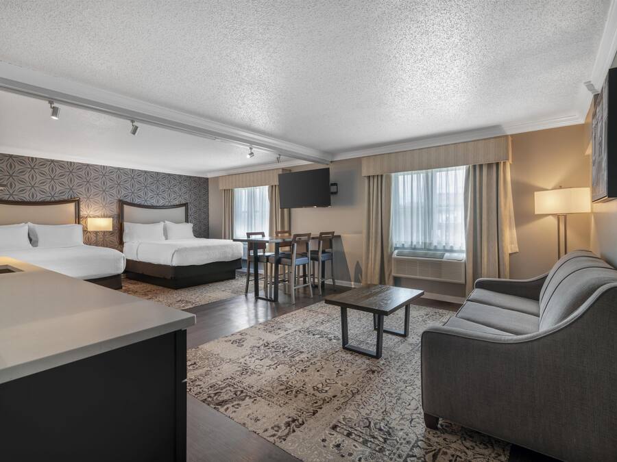 Suite, 2 Queen Beds, Non Smoking, Refrigerator & Microwave (with Sofabed) | Blackout drapes, iron/ironing board, cribs (free), high-speed internet