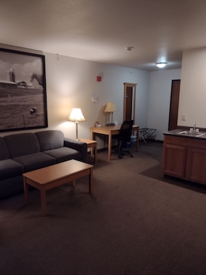 Suite, 1 Queen Bed, Refrigerator | Living area | TV