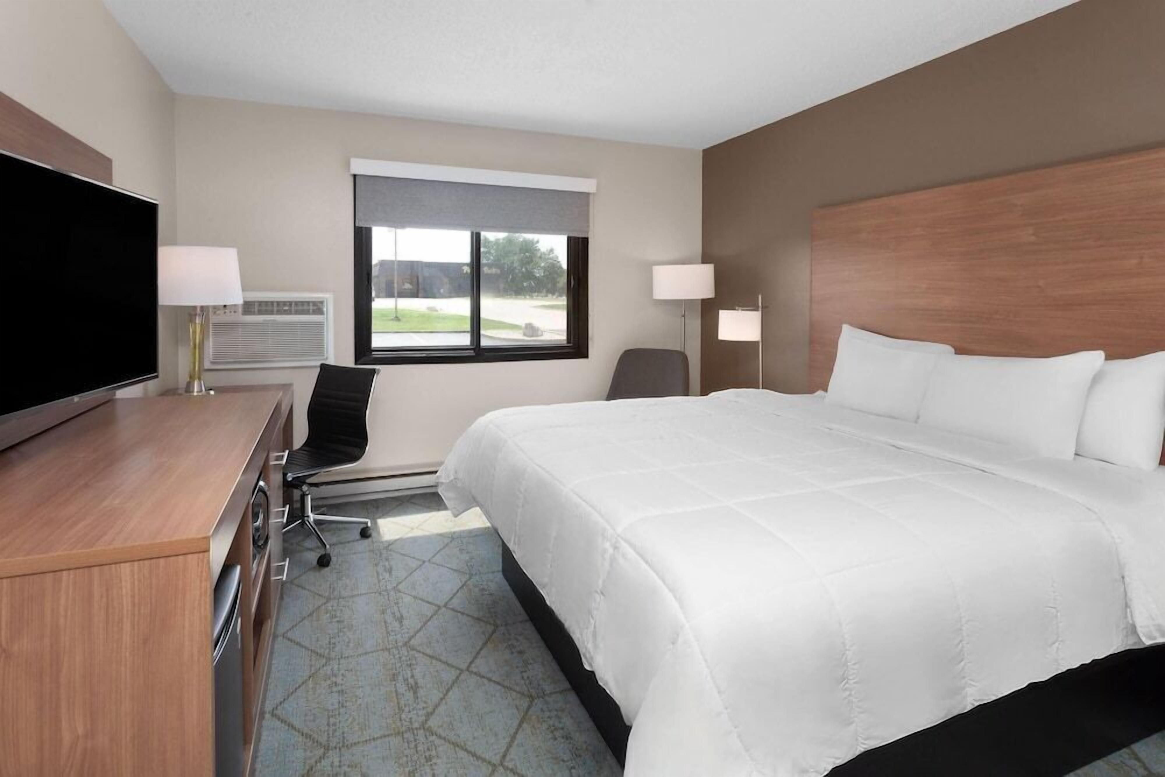 Premium bedding, desk, laptop workspace, free WiFi