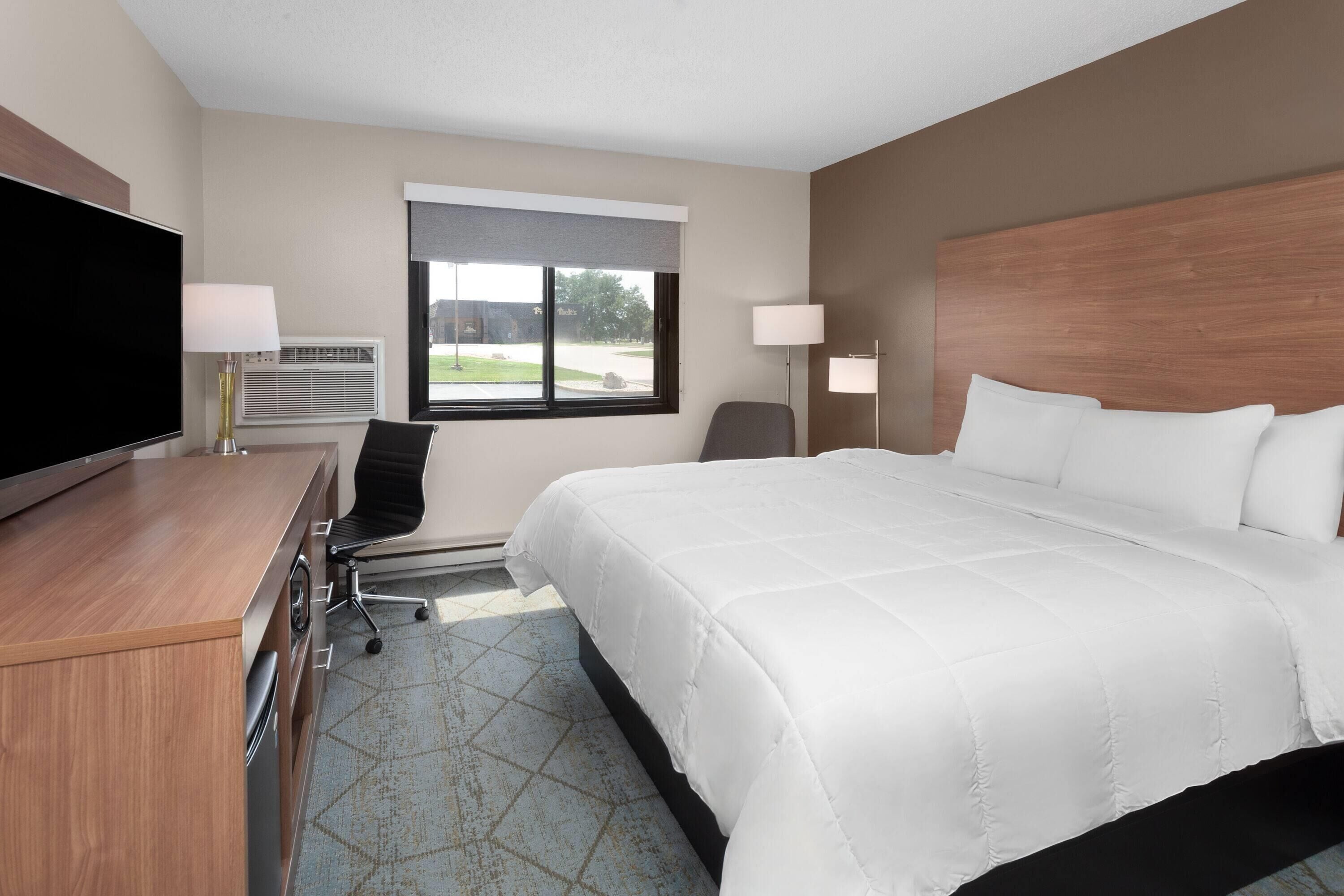 Premium bedding, desk, laptop workspace, free WiFi