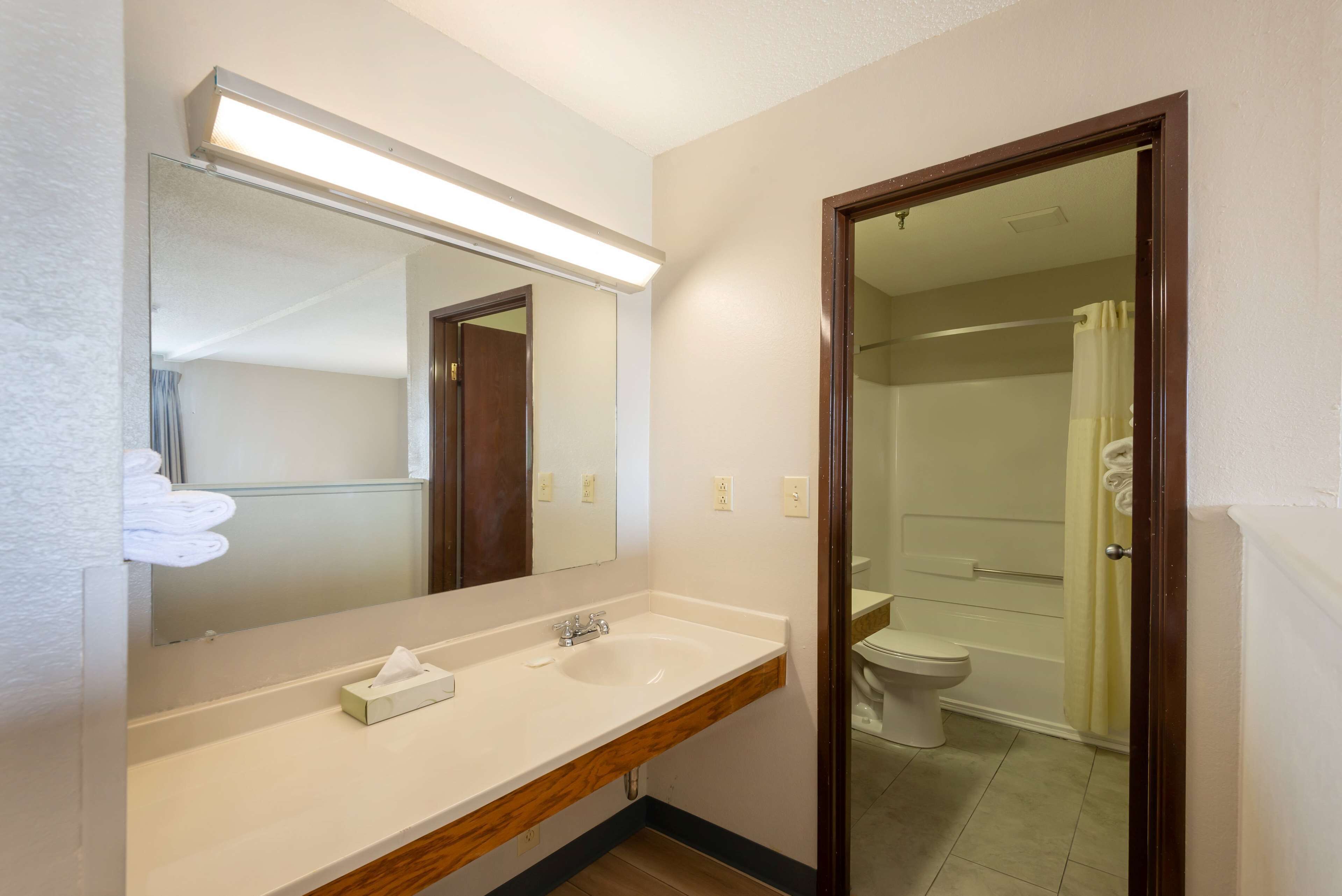 Suite, 2 Queen Beds, Non Smoking | Bathroom | Combined shower/tub, hair dryer, towels