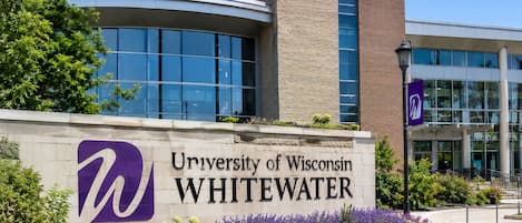 A building with a sign for the University of Wisconsin Whitewater.