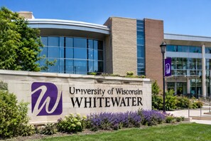 A building with a sign for the University of Wisconsin Whitewater.