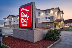 Situated in a well-maintained area, this hotel features a brick facade and landscaped garden.