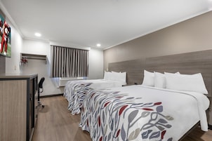 Desk, blackout drapes, iron/ironing board, free cribs/infant beds