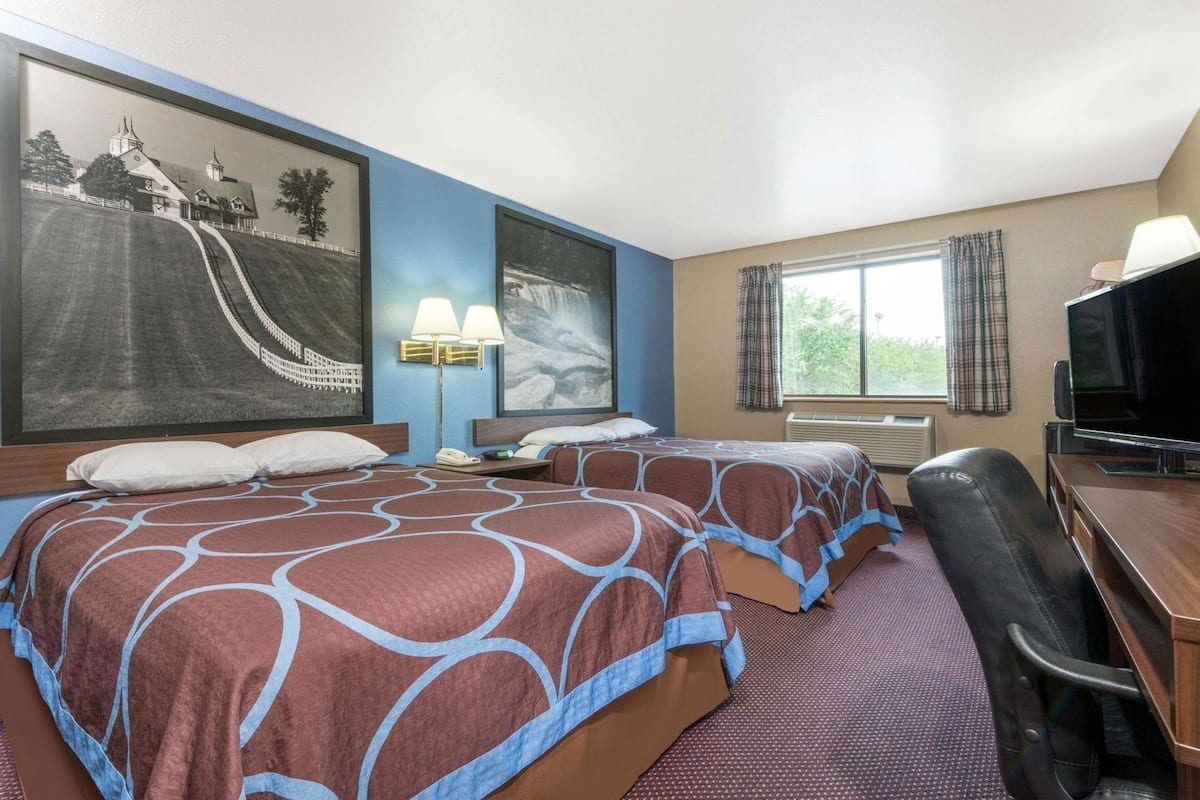 Desk, laptop workspace, iron/ironing board, free cots/infant beds