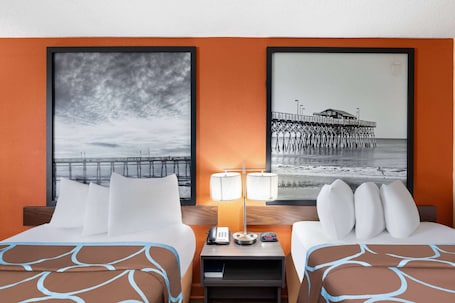 Ropa de cama de alta calidad y caja de seguridad en la habitación