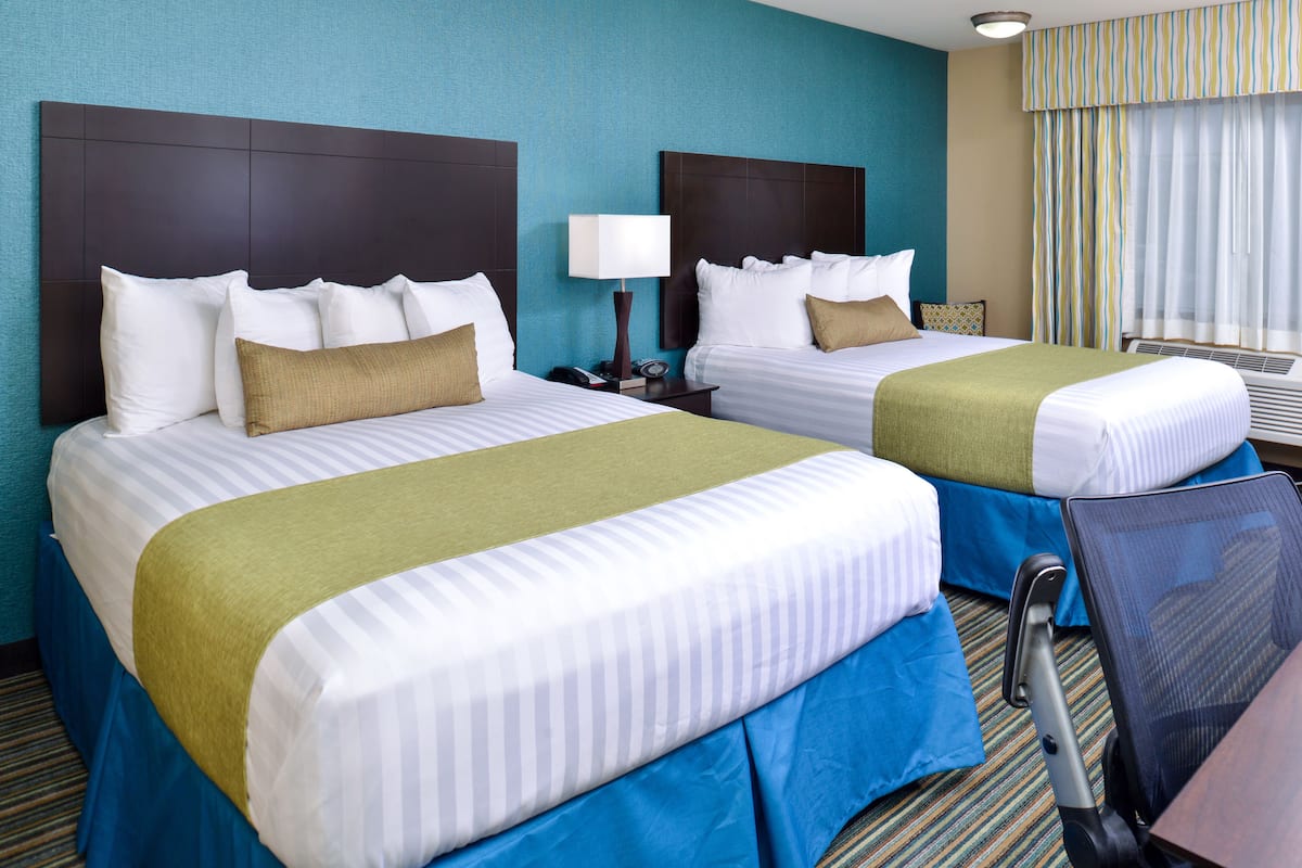 standard room, 2 queen beds, non smoking, refrigerator & microwave | premium bedding, down duvets, pillow-top beds, individually decorated