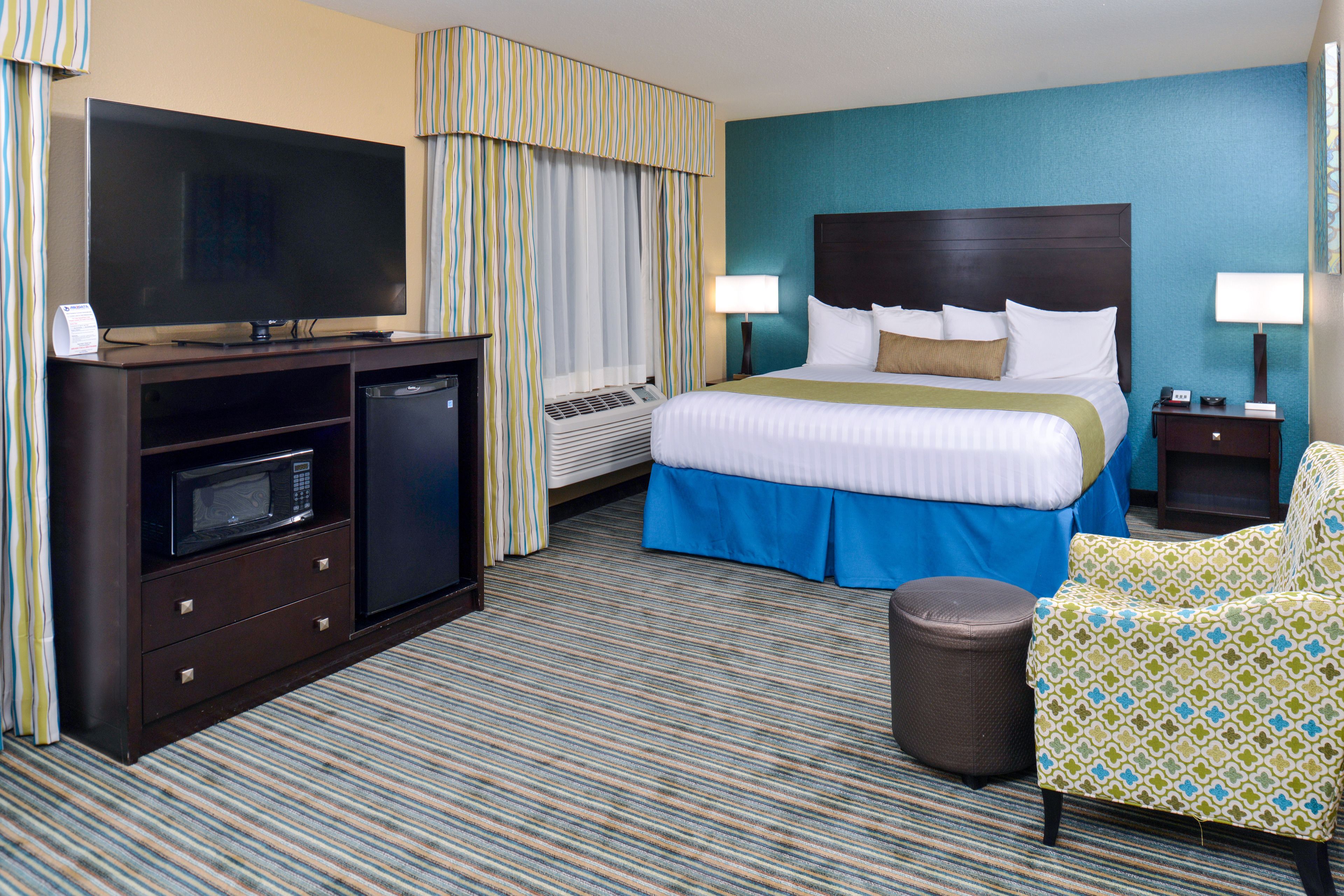 suite, 1 king bed, non smoking, refrigerator & microwave | premium bedding, down duvets, pillow-top beds, individually decorated