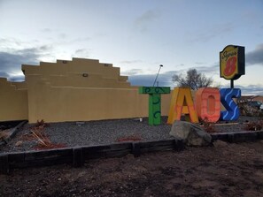 Welcome to Super 8 TAOS, situated in a charming building with a stepped facade.
