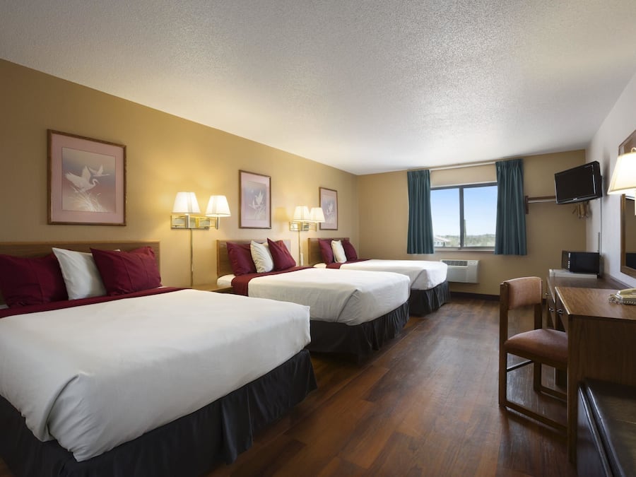 Desk, laptop workspace, iron/ironing board, cribs/infant beds