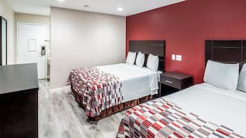Pillowtop beds, desk, blackout drapes, iron/ironing board