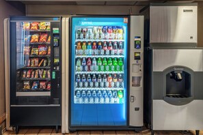 A row of vending machines with various snacks and beverages. - Red Roof Inn St George, UT - Convention Center (St. George)