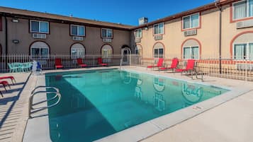 Seasonal outdoor pool, open 10:00 AM to 9:00 PM, pool umbrellas