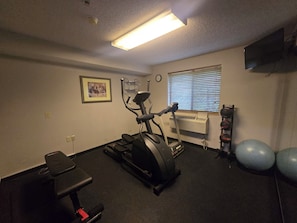Guests can work out in this well-equipped room featuring a single exercise machine, bench, and exercise balls.