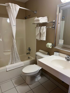 Room, 1 King Bed, Non Smoking | Bathroom | Combined shower/tub, rainfall showerhead, free toiletries, hair dryer