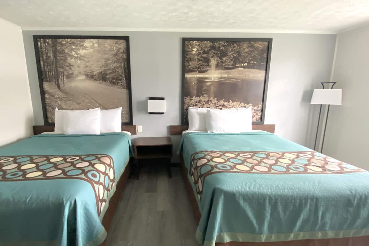 standard room, 2 queen beds, non smoking | in-room safe, iron/ironing board, free wifi, alarm clocks