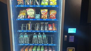 A vending machine with snacks and drinks. - Super 8 by Wyndham Warrenton (Warrenton)