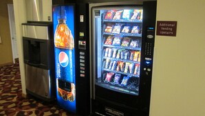 A vending machine with a Pepsi logo and a water dispenser. - Mountaineer Inn (Philippi)