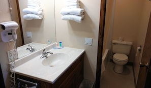 Standard Room, 1 King Bed, Non Smoking | Bathroom amenities | Combined shower/tub, free toiletries, hair dryer, towels