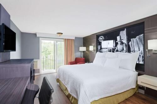 Desk, blackout drapes, iron/ironing board, bed sheets