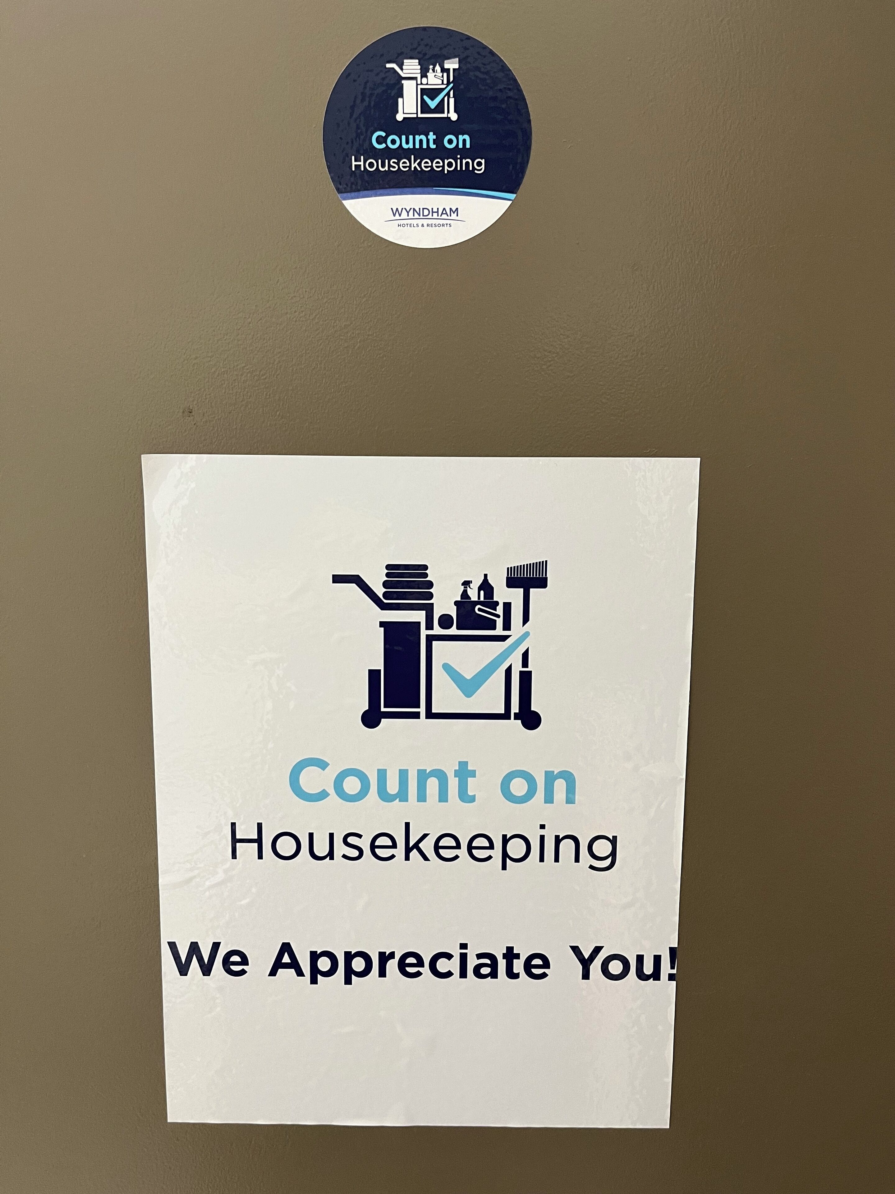 A sign with housekeeping count instructions and a logo.