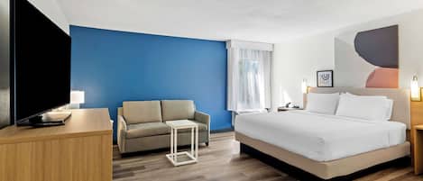 Room, 1 King Bed with Sofa bed | Living area | Flat-screen TV