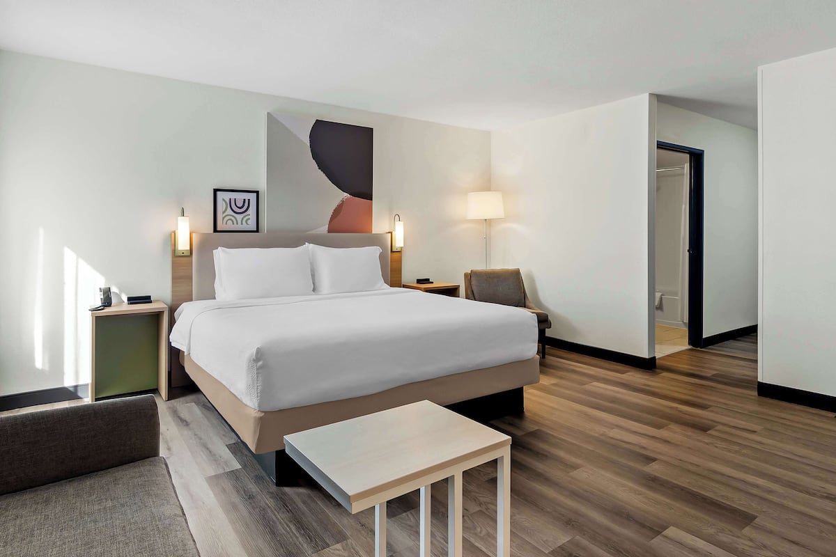 Room, 1 King Bed with Sofa bed | Living area | Flat-screen TV
