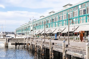 A waterfront building with a wooden dock extending into the water, featuring a sign that reads "NO ENTRY PRIVATE PROPERTY." - Ovolo Sydney Woolloomooloo, a Wyndham Hotel (Woolloomooloo)