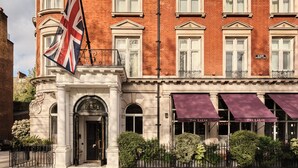 A historic building with a red brick facade, white window frames, and a flagpole with the Union Jack. - The Cadogan, A Belmond Hotel, London (London)