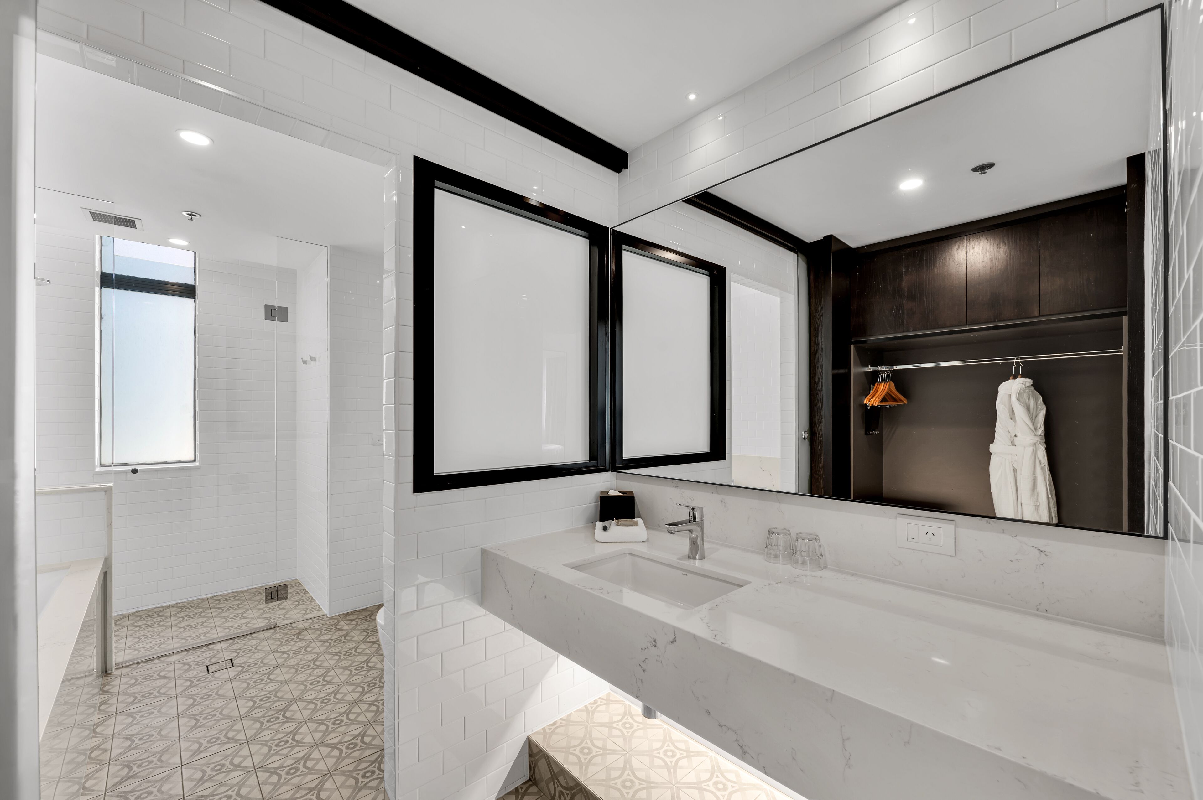 signature premium corner king room | bathroom | designer toiletries, hair dryer, slippers, towels