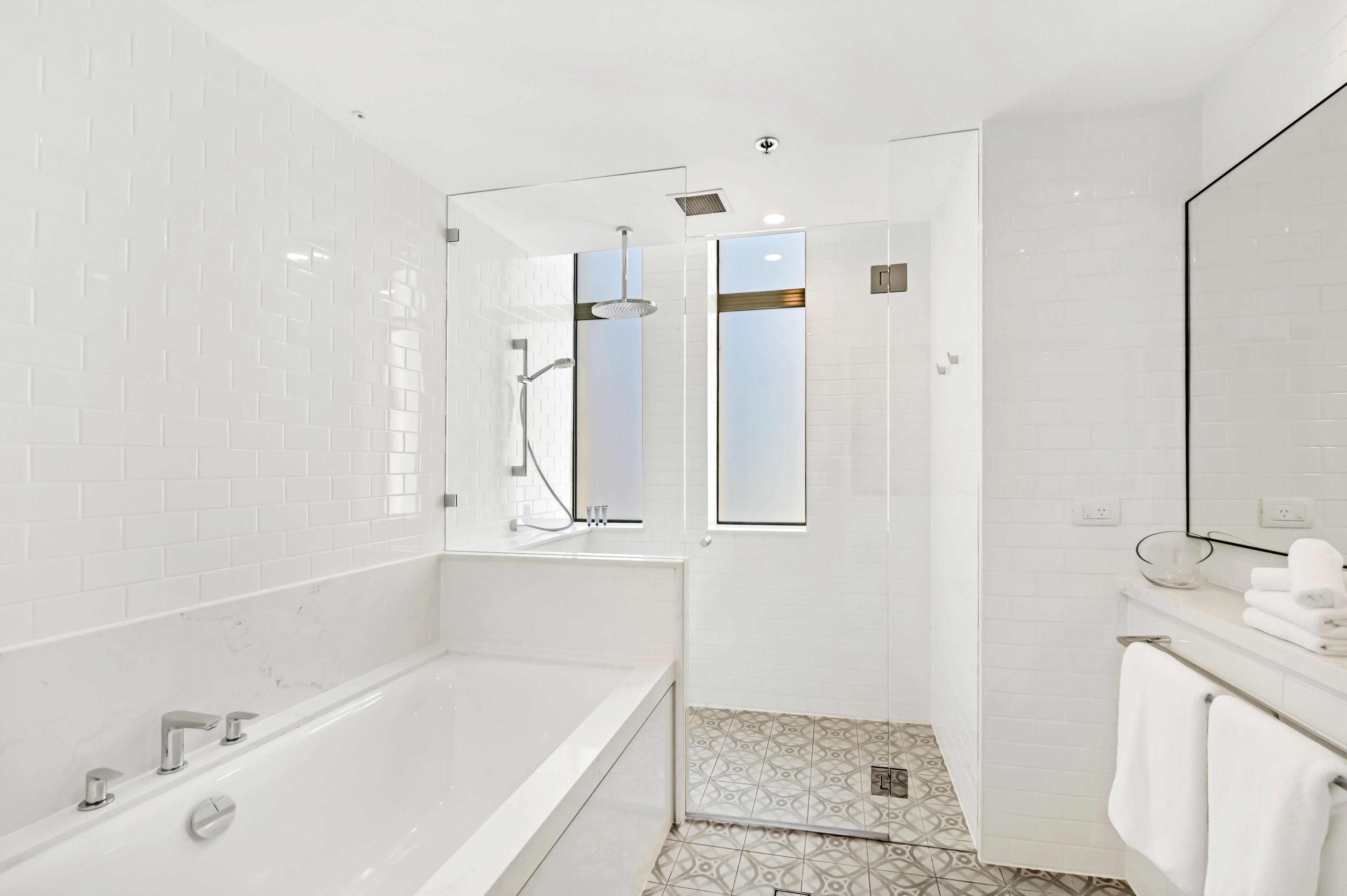 signature premium corner king room | bathroom | designer toiletries, hair dryer, slippers, towels